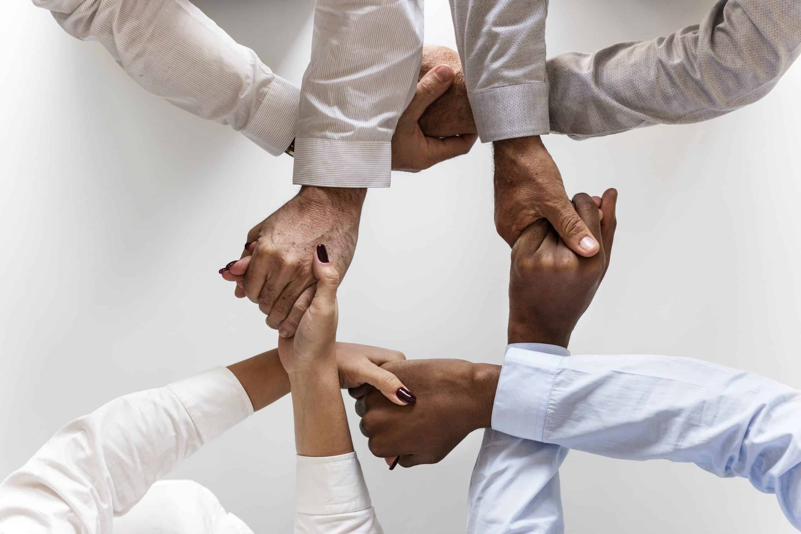 Safeguarding & Wellbeing business-hands-joined-together-teamwork