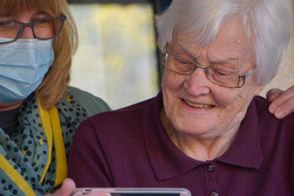 Care worker looking after elderly patient