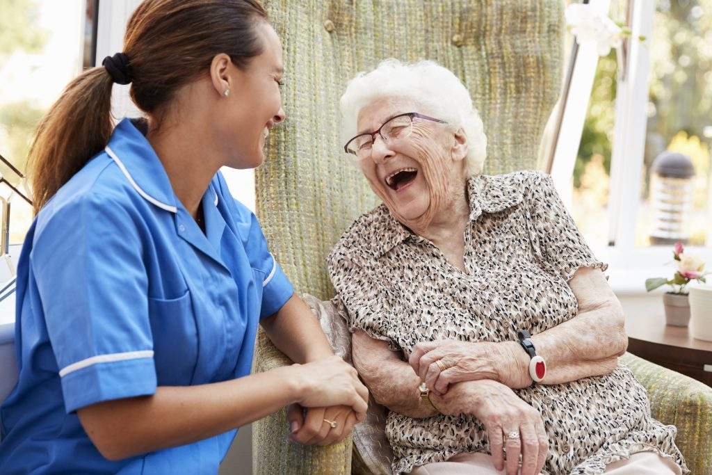 woman and elderly lady in wheelchair